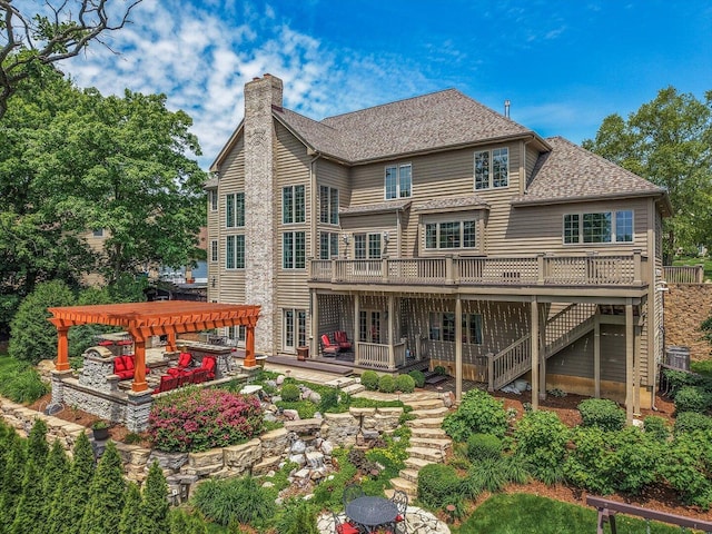 1325 Westley Ln, West Dundee, IL 60118 - rear view of property featuring a pergola, a wooden deck, stairs, a chimney, and a shingled roof