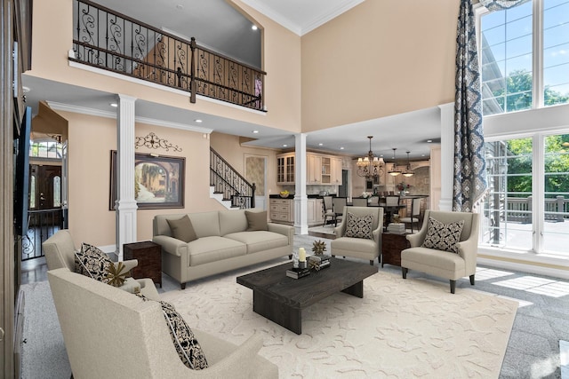 1325 Westley Ln, West Dundee, IL 60118 - living area with a high ceiling, crown molding, stairway, decorative columns, and a chandelier