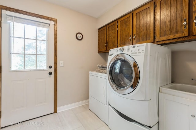 1532 Sequoia Rd, Naperville, IL 60540 - laundry area with washing machine and clothes dryer, cabinet space, and light tile patterned floors