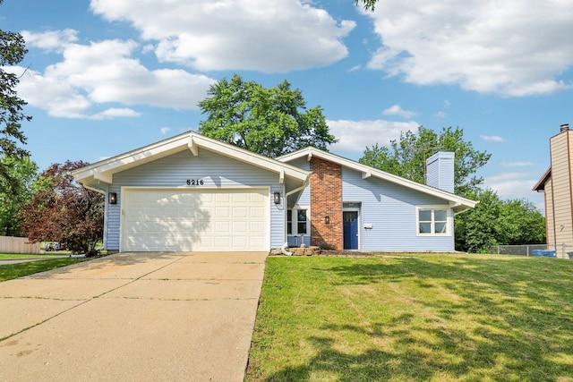5216 Arlington Cir, Hanover Park, IL 60133 - view of front of property featuring a chimney, an attached garage, and concrete driveway