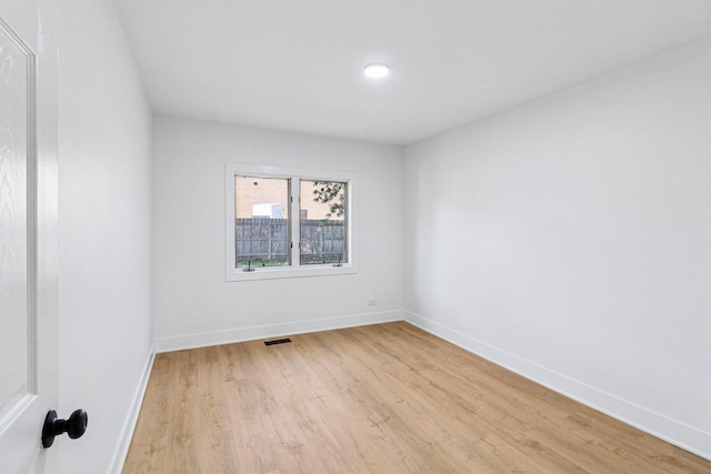 5216 Arlington Cir, Hanover Park, IL 60133 - empty room featuring light wood-style flooring and baseboards