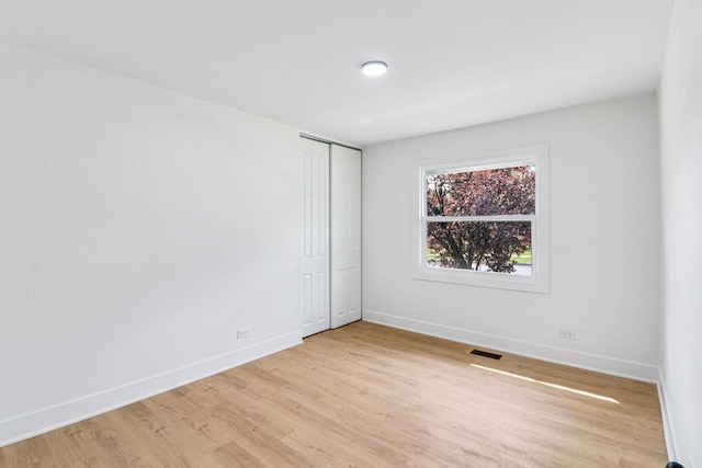 5216 Arlington Cir, Hanover Park, IL 60133 - unfurnished room featuring light wood-type flooring and baseboards