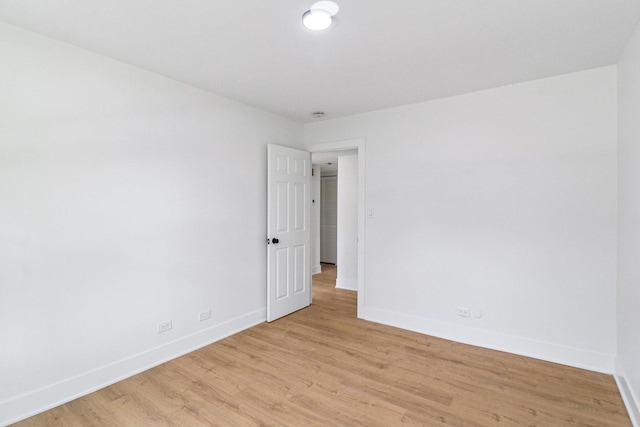 5216 Arlington Cir, Hanover Park, IL 60133 - unfurnished room with baseboards and light wood-type flooring
