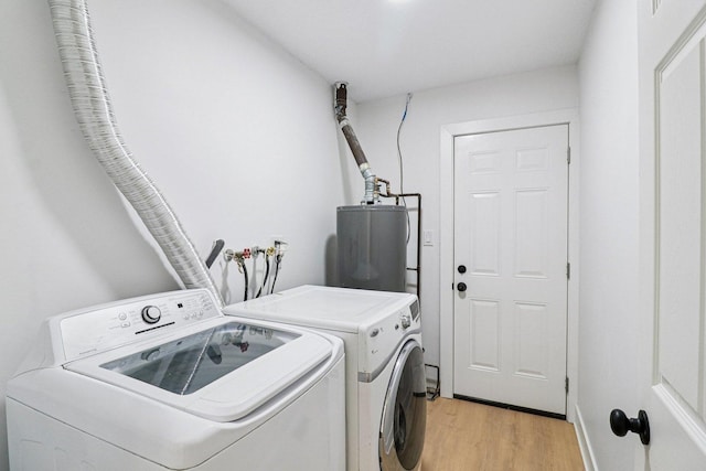 5216 Arlington Cir, Hanover Park, IL 60133 - washroom with washer and clothes dryer, light wood-style floors, and water heater