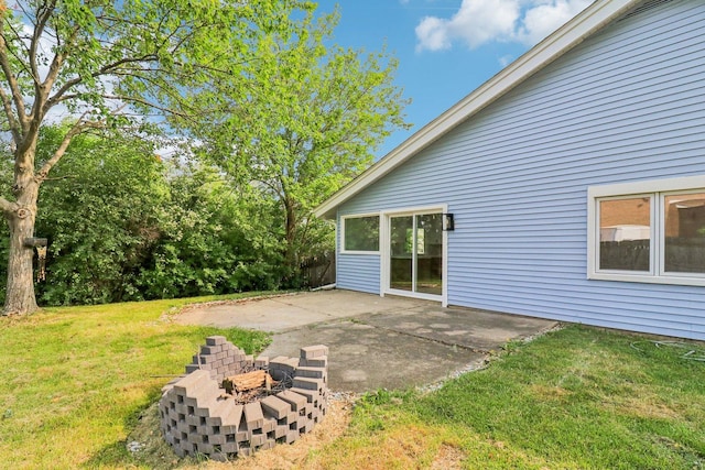 5216 Arlington Cir, Hanover Park, IL 60133 - view of grassy yard featuring a patio and an outdoor fire pit