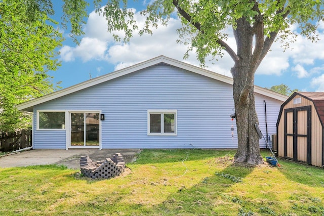 5216 Arlington Cir, Hanover Park, IL 60133 - rear view of house with a storage shed, a yard, and a patio area