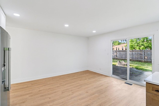 5216 Arlington Cir, Hanover Park, IL 60133 - empty room with light wood-style floors and recessed lighting