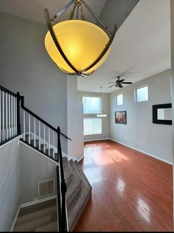 1214 Vista Dr, Gurnee, IL 60031 - stairway featuring ceiling fan and wood finished floors