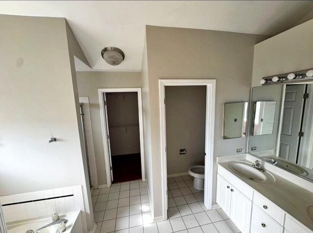 1214 Vista Dr, Gurnee, IL 60031 - full bathroom featuring double vanity, tile patterned flooring, and a bath