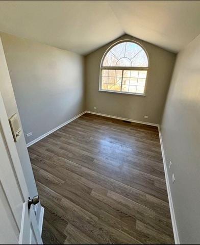 1214 Vista Dr, Gurnee, IL 60031 - unfurnished room featuring vaulted ceiling and dark wood-style floors