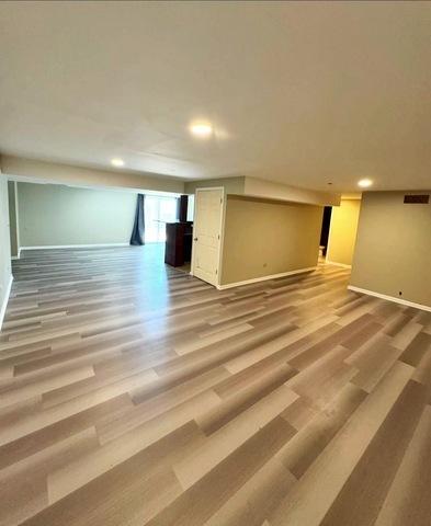 1214 Vista Dr, Gurnee, IL 60031 - below grade area featuring wood finished floors and recessed lighting