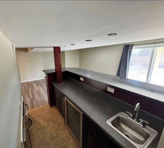1214 Vista Dr, Gurnee, IL 60031 - kitchen with a sink and dark countertops