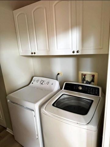 1214 Vista Dr, Gurnee, IL 60031 - washroom with washing machine and clothes dryer and cabinet space