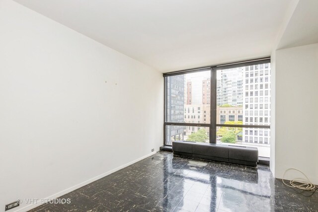900 N Lake Shore Dr Unit 708, Chicago, IL 60611 - spare room with floor to ceiling windows and a view of city