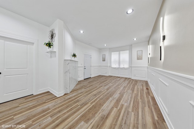 6630 S Drexel Ave, Chicago, IL 60637 - spare room with light wood-style flooring, recessed lighting, a decorative wall, and wainscoting