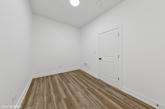 6630 S Drexel Ave, Chicago, IL 60637 - unfurnished room with wood finished floors and a smoke detector