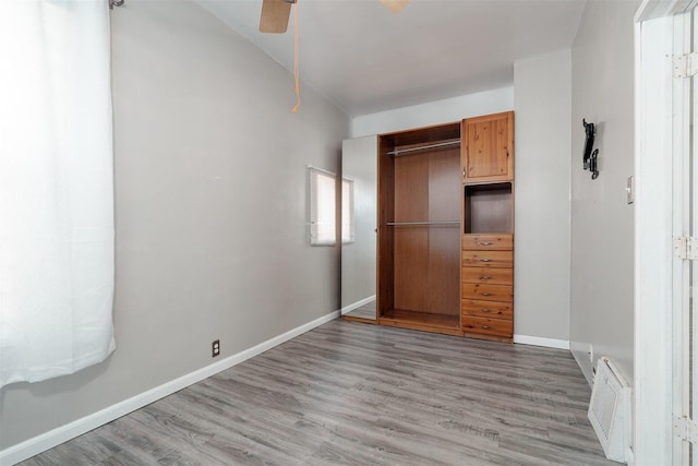 1006 S Adelaide St, Normal, IL 61761 - unfurnished bedroom with light wood finished floors, a closet, and ceiling fan