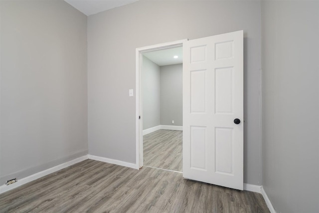 1006 S Adelaide St, Normal, IL 61761 - spare room featuring wood finished floors and baseboards