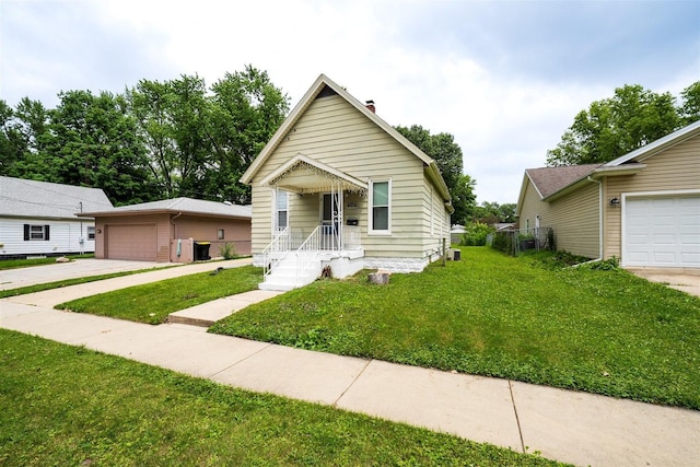 1006 S Adelaide St, Normal, IL 61761 - view of front of home with a front yard and a garage