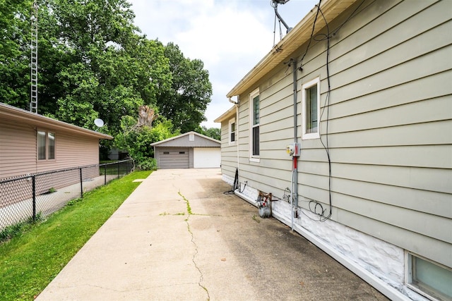 1006 S Adelaide St, Normal, IL 61761 - view of property exterior featuring an outdoor structure and a detached garage