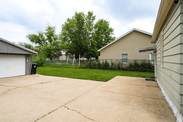 1006 S Adelaide St, Normal, IL 61761 - view of yard featuring a garage and concrete driveway