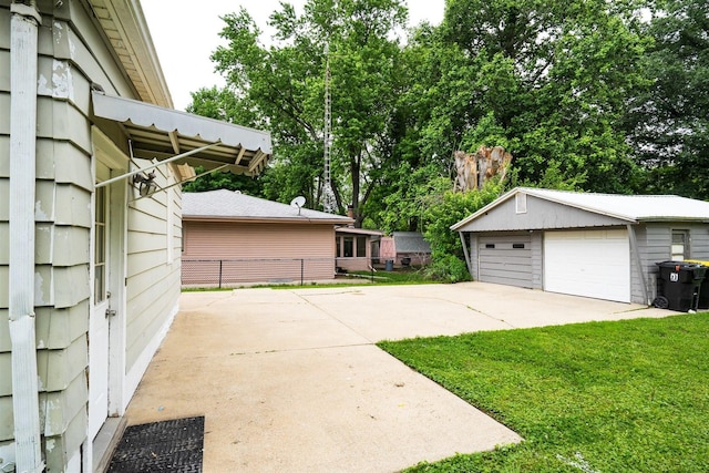 1006 S Adelaide St, Normal, IL 61761 - view of patio / terrace with an outdoor structure, a detached garage, and view of scattered trees