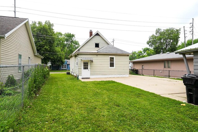 1006 S Adelaide St, Normal, IL 61761 - rear view of property featuring a patio and a chimney