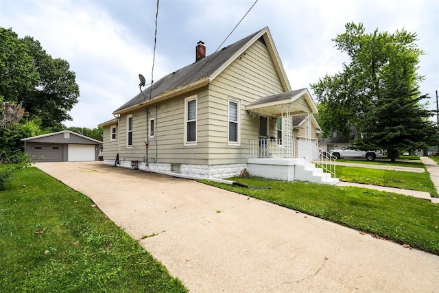1006 S Adelaide St, Normal, IL 61761 - view of property exterior with a chimney, a yard, an outdoor structure, and a garage
