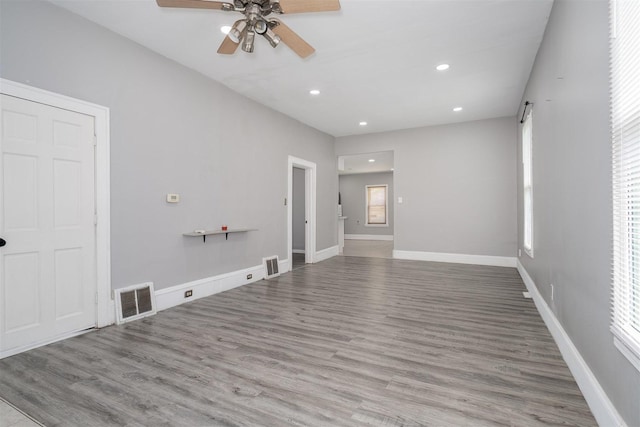 1006 S Adelaide St, Normal, IL 61761 - unfurnished living room featuring a ceiling fan, recessed lighting, and wood finished floors