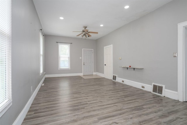 1006 S Adelaide St, Normal, IL 61761 - unfurnished living room featuring ceiling fan, recessed lighting, and wood finished floors