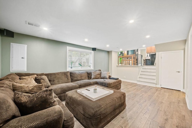 537 W Stearns Rd, Bartlett, IL 60103 - living room featuring electric panel, light wood-style flooring, and recessed lighting