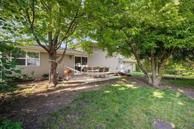 537 W Stearns Rd, Bartlett, IL 60103 - back of property featuring a patio area, a trampoline, a lawn, and entry steps