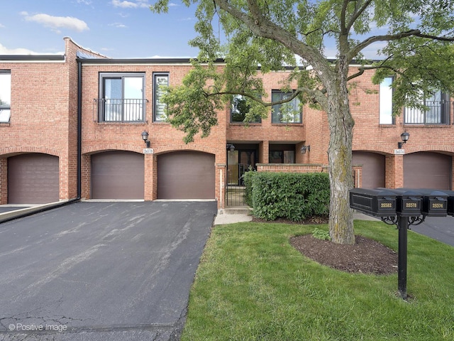 2S578 Patrick Henry Sq Unit 578, Oak Brook, IL 60523 - townhome / multi-family property featuring driveway, a garage, and brick siding