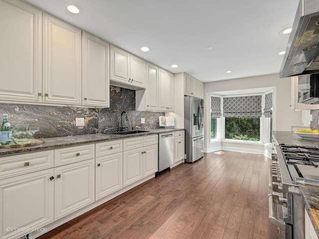 2S578 Patrick Henry Sq Unit 578, Oak Brook, IL 60523 - kitchen featuring stainless steel appliances, range hood, decorative backsplash, dark wood-style flooring, and recessed lighting