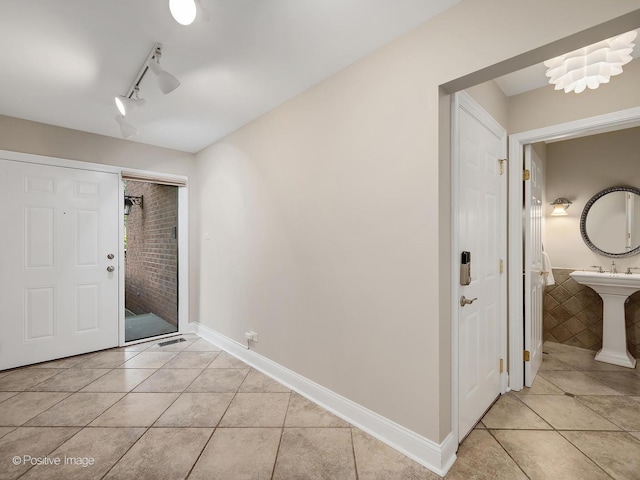 2S578 Patrick Henry Sq Unit 578, Oak Brook, IL 60523 - entryway with light tile patterned floors and track lighting