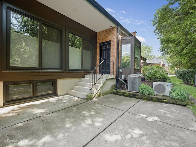 2S578 Patrick Henry Sq Unit 578, Oak Brook, IL 60523 - doorway to property featuring a patio area and brick siding