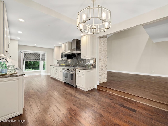2S578 Patrick Henry Sq Unit 578, Oak Brook, IL 60523 - kitchen with appliances with stainless steel finishes, wall chimney exhaust hood, a chandelier, tasteful backsplash, and dark wood-style floors