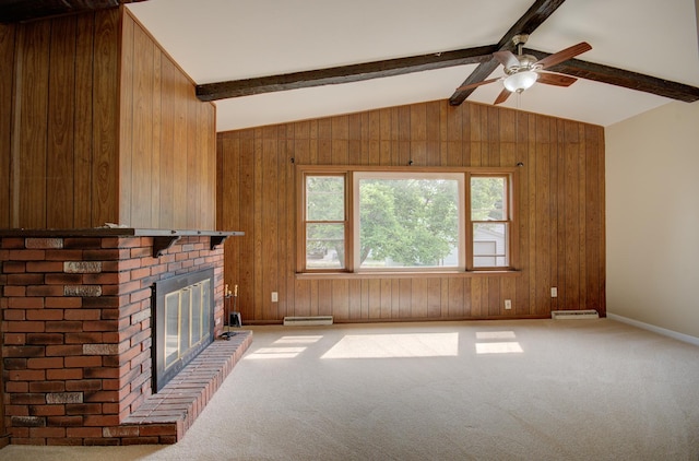 1318 N Prairie Ave, Joliet, IL 60435 - unfurnished living room with a baseboard radiator, a brick fireplace, light carpet, wooden walls, and a ceiling fan