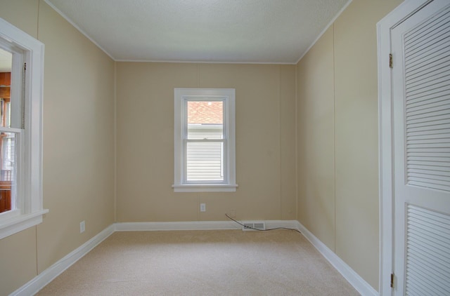 1318 N Prairie Ave, Joliet, IL 60435 - empty room with ornamental molding and light colored carpet