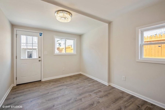 2155 N Mobile Ave, Chicago, IL 60639 - entryway featuring wood finished floors and a chandelier