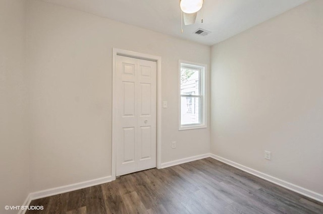 2155 N Mobile Ave, Chicago, IL 60639 - spare room with dark wood finished floors and a ceiling fan