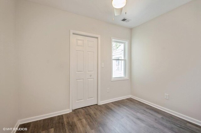 2155 N Mobile Ave, Chicago, IL 60639 - spare room with dark wood finished floors and a ceiling fan