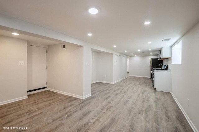 2155 N Mobile Ave, Chicago, IL 60639 - finished basement featuring light wood finished floors and recessed lighting