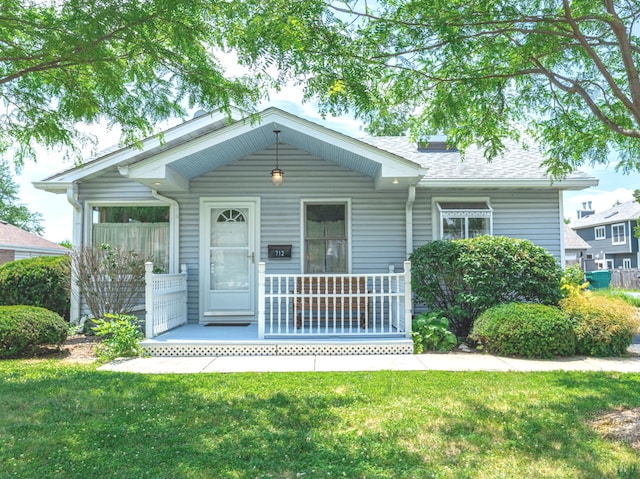 712 S Finley Rd, Lombard, IL 60148 - view of front of house with covered porch and a front yard