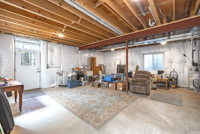 712 S Finley Rd, Lombard, IL 60148 - below grade area featuring gas water heater and plenty of natural light