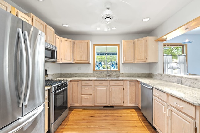 712 S Finley Rd, Lombard, IL 60148 - kitchen with stainless steel appliances, light brown cabinetry, recessed lighting, light stone countertops, and light wood-type flooring