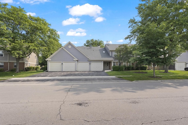 78 Holmes Way Unit W1, Schaumburg, IL 60193 - view of front of home featuring an attached garage, driveway, and a front lawn