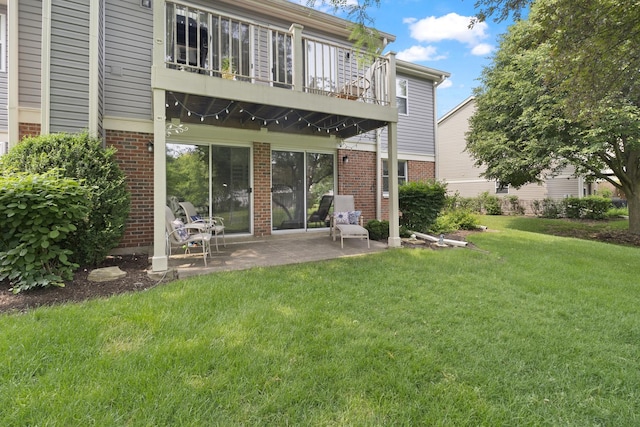 78 Holmes Way Unit W1, Schaumburg, IL 60193 - back of house featuring a balcony, brick siding, a patio, and a lawn