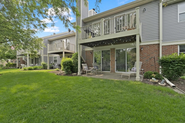 78 Holmes Way Unit W1, Schaumburg, IL 60193 - back of property featuring a chimney, a yard, brick siding, and a patio area