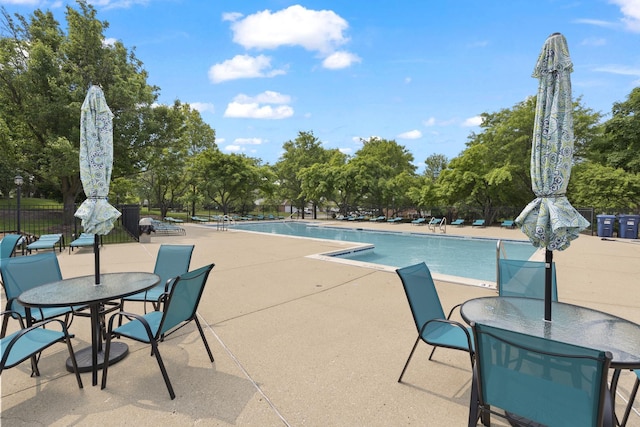 78 Holmes Way Unit W1, Schaumburg, IL 60193 - community pool featuring a patio and view of scattered trees